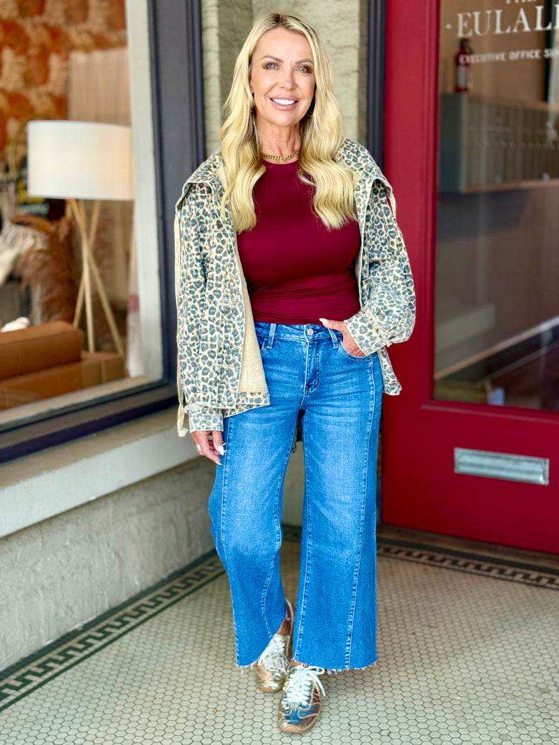 High Rise Raw Hem Twist Wide Leg Jeans