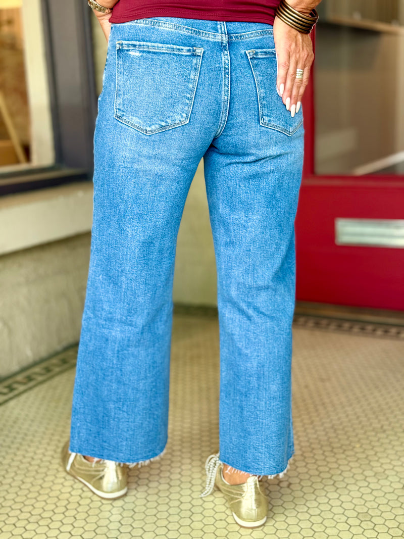 High Rise Raw Hem Twist Wide Leg Jeans