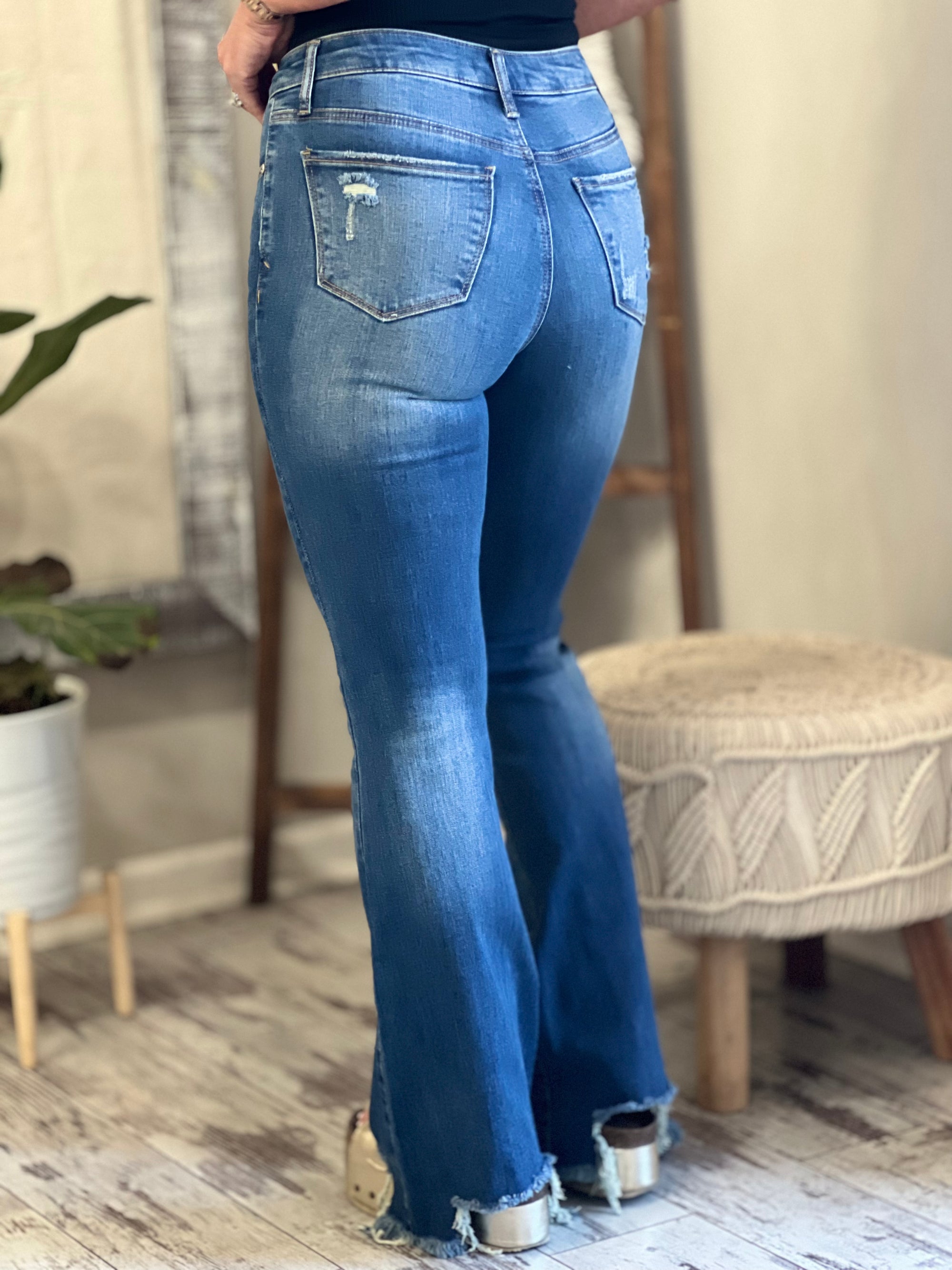 Mid Rise Asymmetric Hem Flare Jeans